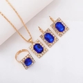 Elegant gold jewelry set with rectangular blue gemstone and crystal accents - Three-Piece Set / Square-Blue
