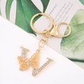 Detail of gold letter W keychain with butterfly and sparkling rhinestones for bags - Letter W