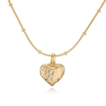 Detailed close-up of a gold lava textured heart pendant necklace with shimmering crystals - Gold Pleated Heart Bead Chain