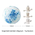 Blue and white 100g bath salt bomb with 5.8cm diameter and a cartoon finger toy - 100g Finger Toy (Ocean)