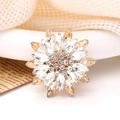 Sunflower shaped brooch with champagne crystals and sparkling rhinestones on golden metal - White