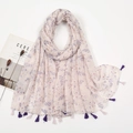 Detailed view of floral pattern and purple tassels on a lightweight cotton-linen scarf - XB1008-01 Light Pink Floral Leaves Tassels