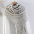 Light grey crinkle cotton linen scarf with frayed edges displayed on a wooden hanger - Light Gray