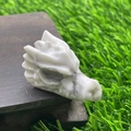 White marble texture natural stone dragon head sculpture on dark wood base - White Turquoise