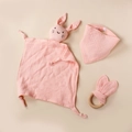 Detail of pink cotton muslin baby bib, wooden rabbit ear rattle and plush comforter set - 30*30 cm / Baby Pink