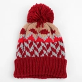 Detailed view of winter knit beanie showing colorful geometric jacquard and thick red pom-pom - One Size (Elastic) / Red