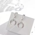 Silver crescent moon earrings with green gemstone inlay on white display stand - Silver Style (ER-587)