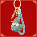 Sparkling blue rhinestone duck keychain with pink bow and light blue braided leather strap - Braided Blue Rhinestone Duck