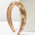 Detail of padded headband with champagne rhinestones and blue heart-shaped gems - Brown