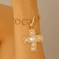 Golden textured chain bracelet with a large pearl-inlaid cross charm and T-bar clasp - Gold Bracelet (Pearl Cross A-690)