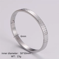 Detail view of 6mm silver checkerboard bangle with dimensions 58x50mm and 23g weight - Women's Steel Color