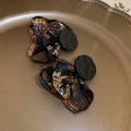 Detailed shot of Chinese style earrings with black matte buckle and gold floral fabric - Black (925 Sterling Silver Earring Post)