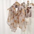 Beige floral print voile scarf with elegant yellow flower patterns on wooden hanger - Beige Yellow Brown Floral
