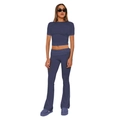 Detail view of navy blue two-piece set featuring slim crop top and flared pants fabric - Navy Blue
