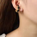 Vintage style gold-plated hoops with black enamel oval inlays on female model - Black Glaze Gold