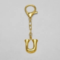 Polished 18k gold-plated keychain with uppercase letter U pendant on a lobster clasp - Letter U