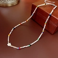 Baroque pearl necklace with white flower pendant and colorful cube beads on leather box - Colorful Rice Bead Crushed Silver Necklace