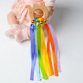 Elephant-shaped wooden baby teether toy with rainbow silk ribbons and a gold bell - Bell Elephant