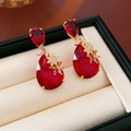 Vintage style red pear-shaped gemstone earrings with gold prong setting and crystal details - Silver Earring Post Red Teardrop Gemstone Flower Earrings