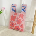 Pink knitted tote bag with red flower patterns and blue geometric patterned handles - Floral Leaf Pink