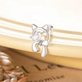 Silver kitten-shaped titanium steel stud earring with heart stone and bow detail - White (Single Piece)