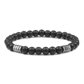 Macro detail of 6mm matte black beads and grey hematite accents on a yoga bracelet - Frosted