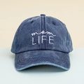Detailed view of mom LIFE white embroidery on washed navy blue cotton baseball cap texture - Washed Navy Blue