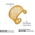 Macro view of 18k gold plated stainless steel wire-wrapped wide open bangle details - Gold