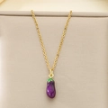 Detailed close-up of a purple eggplant pendant on a gold chain against beige fabric - Purple Eggplant Style (KN292099-Z)