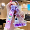 Purple sailboat keychain featuring floating penguin, liquid glitter and Happy wrist strap - Ocean Creature - Little Penguin
