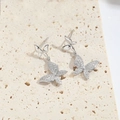 Elegant silver butterfly drop earrings with micro-pave crystals on stone background - Butterfly (Silver)