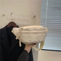 Detail of cream waist bag featuring woven rope zipper pull and adjustable nylon strap - White