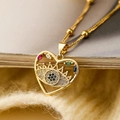 Gold plated heart pendant necklace with colorful zircon evil eye on knit background - Heart-shaped Eye / Gold