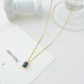 Chic gold chain necklace featuring a rectangular deep green gemstone pendant in 4-prong setting - 14K Gold + Black Zirconia