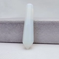 Polished white translucent hexagonal crystal point pillar standing on a white texture base - Opal