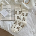 Gemütliche Korallenvlies-Socken in Cremeweiß mit Teddybär-Muster und Rüschenrand - Einheitsgröße / Milchweiß