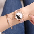 Close-up of elegant rose gold cat pattern watch with pink leather strap and star bracelet - Pink + Bracelet