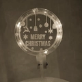 Macro detail of glowing LED Merry Christmas acrylic cake topper with reindeer design - Style 2 Warm Light