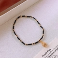 Elegant black beaded bracelet featuring a gold shell pendant and accents in a French style - 4# Bracelet - Black - Shell