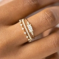Three-piece gold ring set featuring a marquise cut stone and diamond-studded bands - Ajz1766 / Size 6