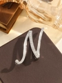 Elegant silver-toned letter N brooch with sparkling crystals on leather background - Silver Letter N