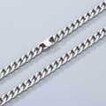 Macro detail of silver stainless steel Cuban link chain with a polished square clasp - 6.6mm Width-Toggle Clasp-45cm Length