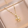 Macro shot of a spinning flower star pendant in gold finish on a jewelry box - X1459 Gold Pentagram Rotating
