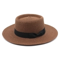 Detail of a brown boater straw hat featuring a black satin bow and fine spiral weaving - M (56-58cm) / Brown