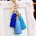 Close-up of three-tier blue silk tassels with gold metal ring and lobster clasp - Three Ice Silk Tassels / Blue Gradient