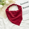 Close-up of dark red chiffon elastic headband with white flowers on minimalist background - Burgundy