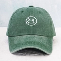 Vintage green washed cotton baseball cap with white embroidered tongue-out smiley face icon - One Size / Dark Green