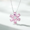 Detailed macro view of pink zircon flower pendant on a polished S925 silver chain - Six-petal Flower Pink Necklace / Pink