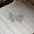 Macro shot of silver butterfly stud earrings with sparkling cubic zirconia on grey velvet - Butterfly Style / Silver / Silver