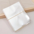 Clear plastic packaging bags for children's hair accessories on a wooden background - 7.9x10cm Clear Bag / 1 Piece